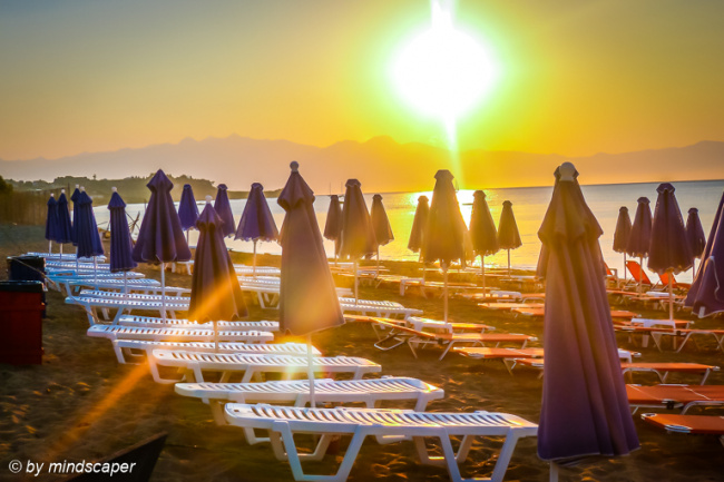 Umbrellas in the Sunrise - Sea and Sun Story